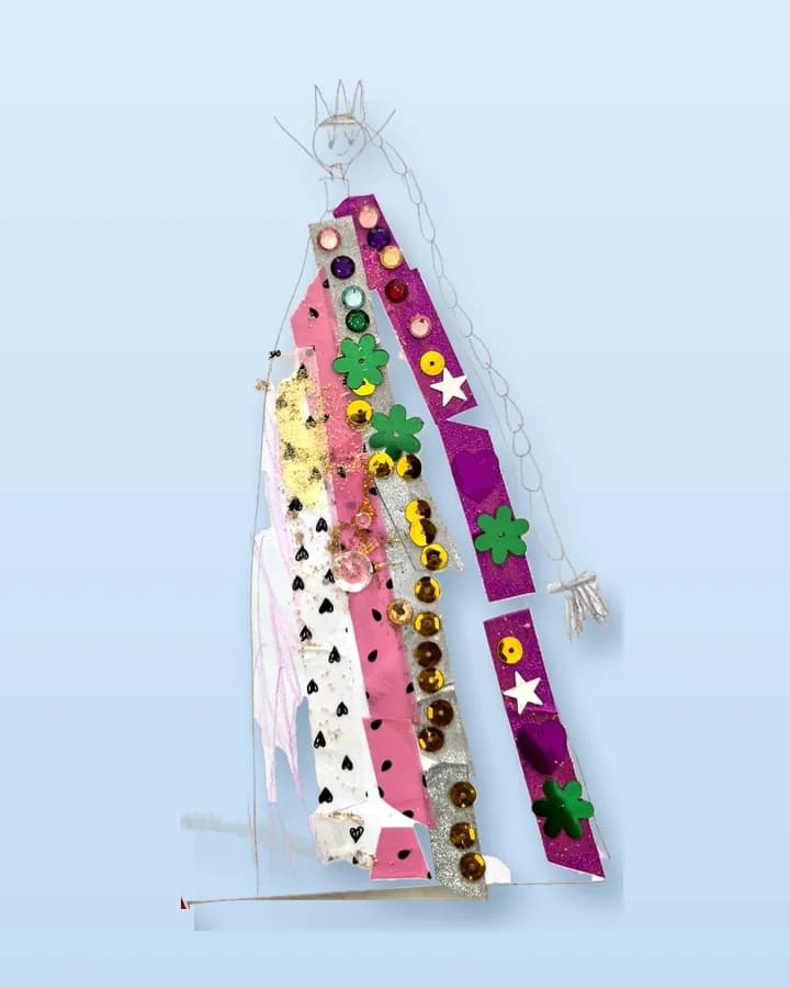The same queen lifted off her page by the app: the pencil, the sequins and the stickers exactly as drawn, standing on a plain surface with a shadow.