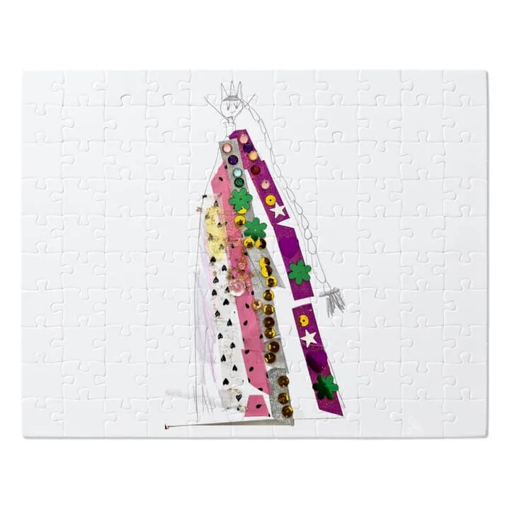 A mockup of the jigsaw: a child's drawing of a queen in a sequinned dress cut into 110 pieces.